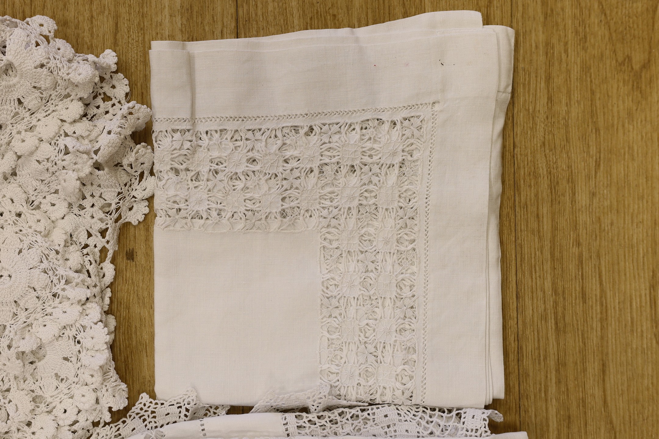 A group of lace table cloths